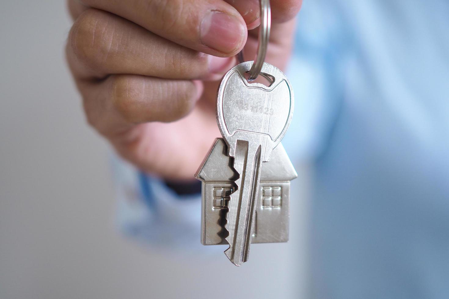 Landlord unlocks the house key for new home photo