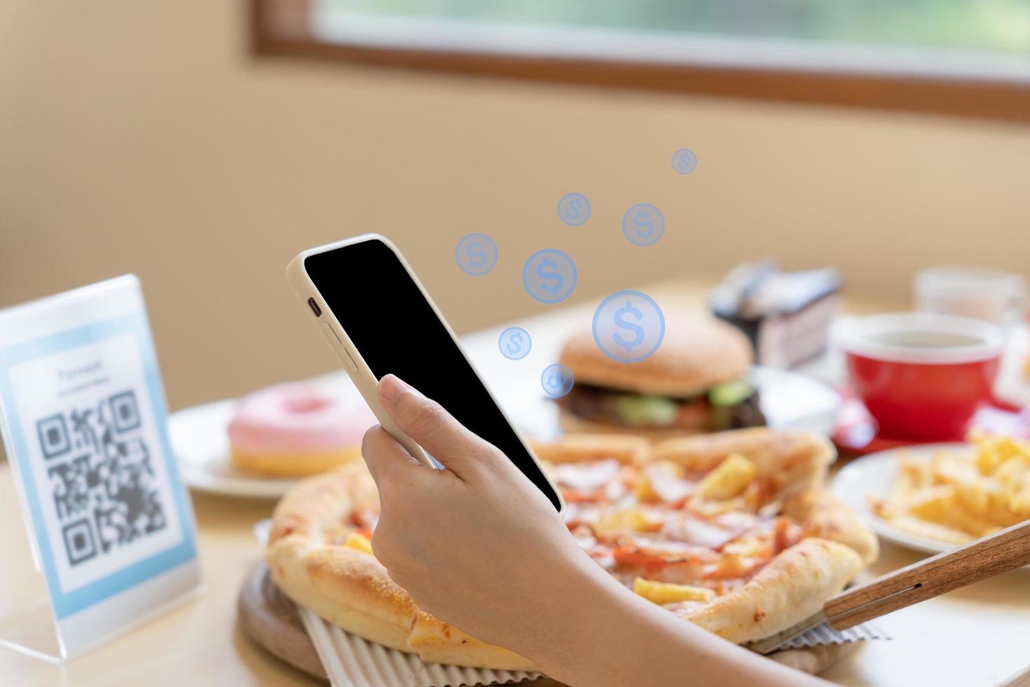 Woman use smartphone to scan QR code to pay in cafe restaurant with a digital payment without cash. Choose menu and order accumulate discount. E wallet, technology, pay online, credit card, bank app. photo