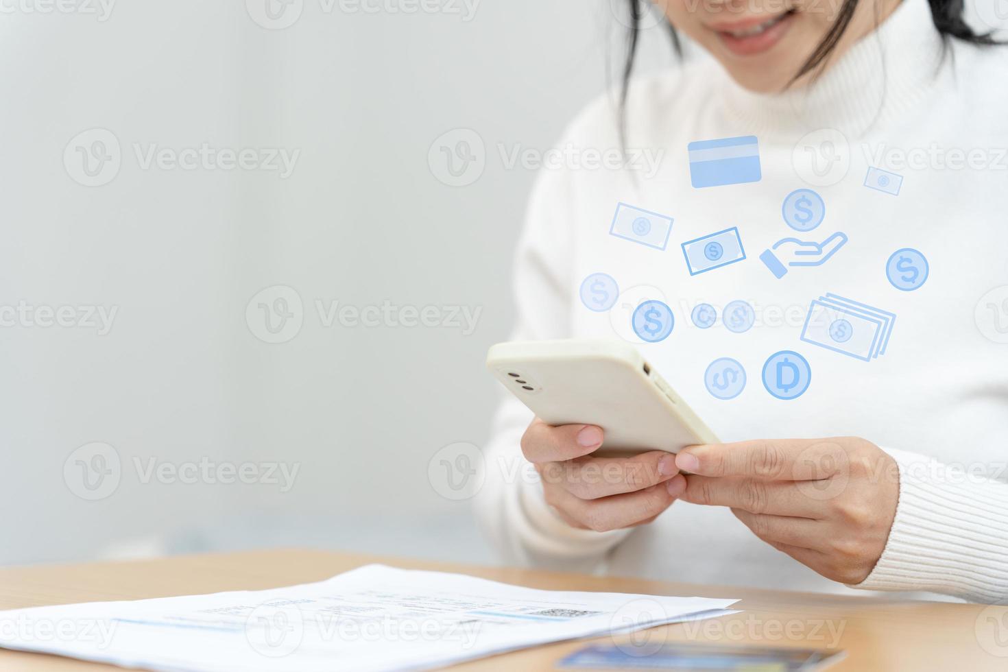 woman using smartphone doing financial transactions through the internet. mobile phone with payment detail page display and credit card, technology, electronic commerce, mobile banking, market place photo