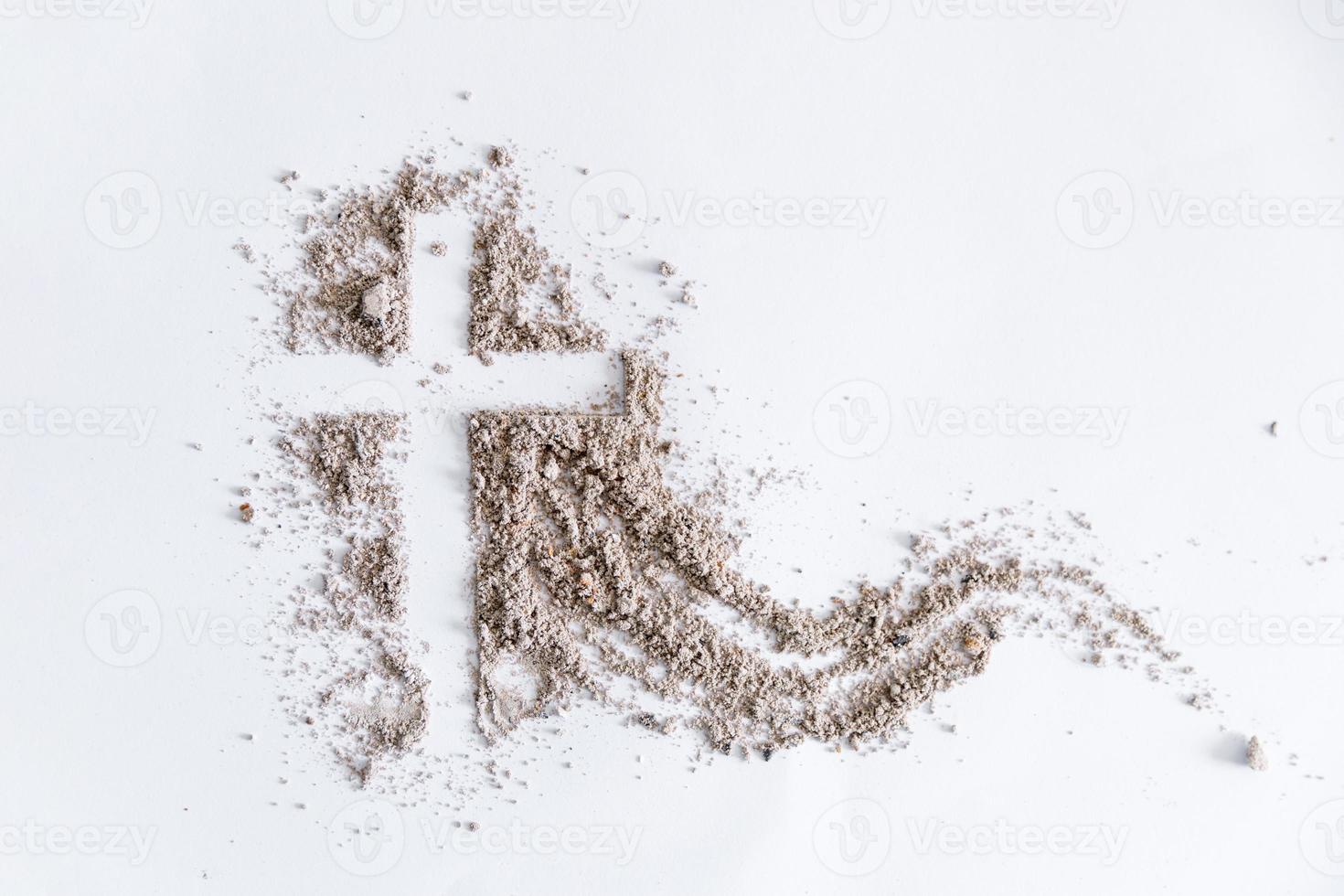 Christian cross or crucifix drawing in ash, dust or sand as symbol of religion, sacrifice, redemption, Jesus Christ, ash wednesday, lent, Good Friday, Easter with Church is devoted to fasting photo
