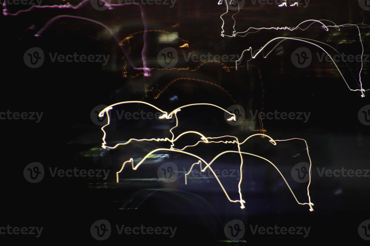 Night exposure zoom traces background. Light lines leaks exposition backdrop. Night city rays glow texture. photo