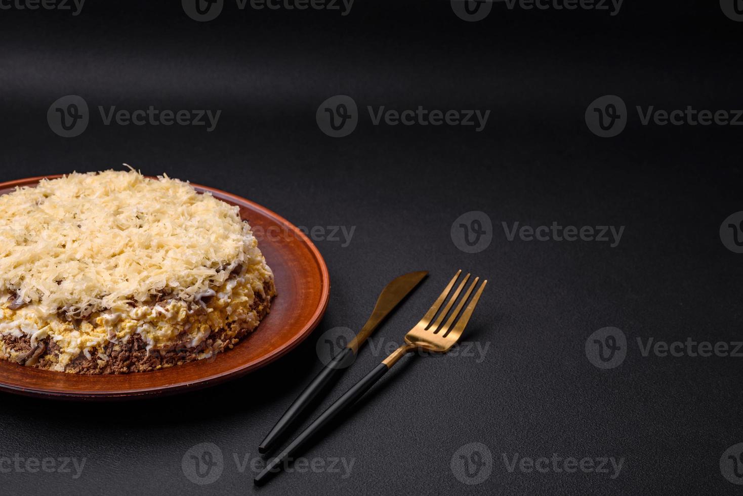 Delicious fresh pie with chicken liver, eggs, onions, carrots and mayonnaise photo