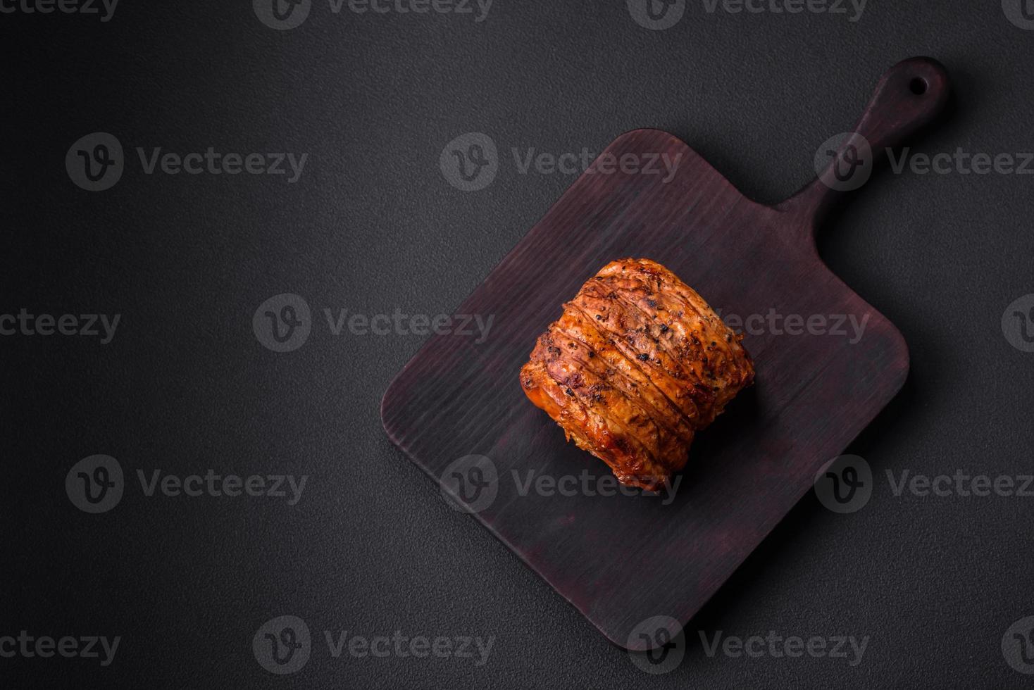 Delicious fresh smoked meat or ham with spices and herbs photo