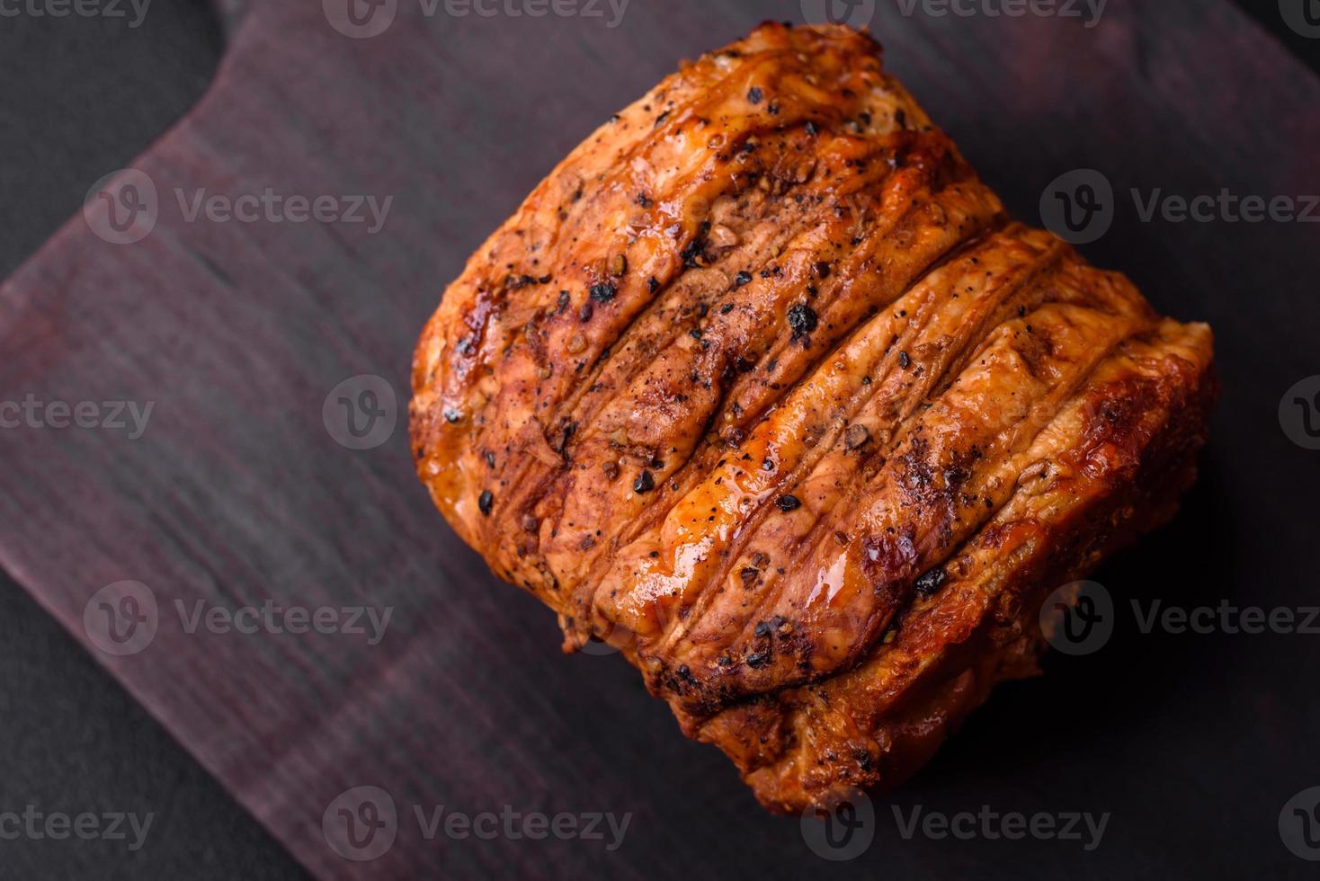 Delicious fresh smoked meat or ham with spices and herbs photo