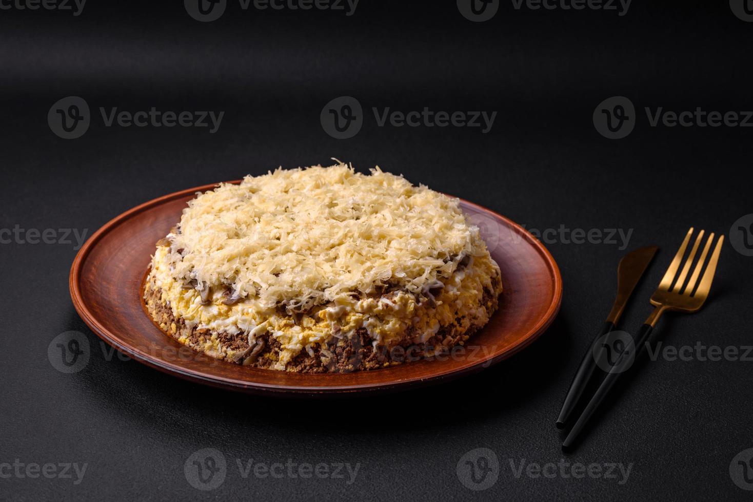Delicious fresh pie with chicken liver, eggs, onions, carrots and mayonnaise photo