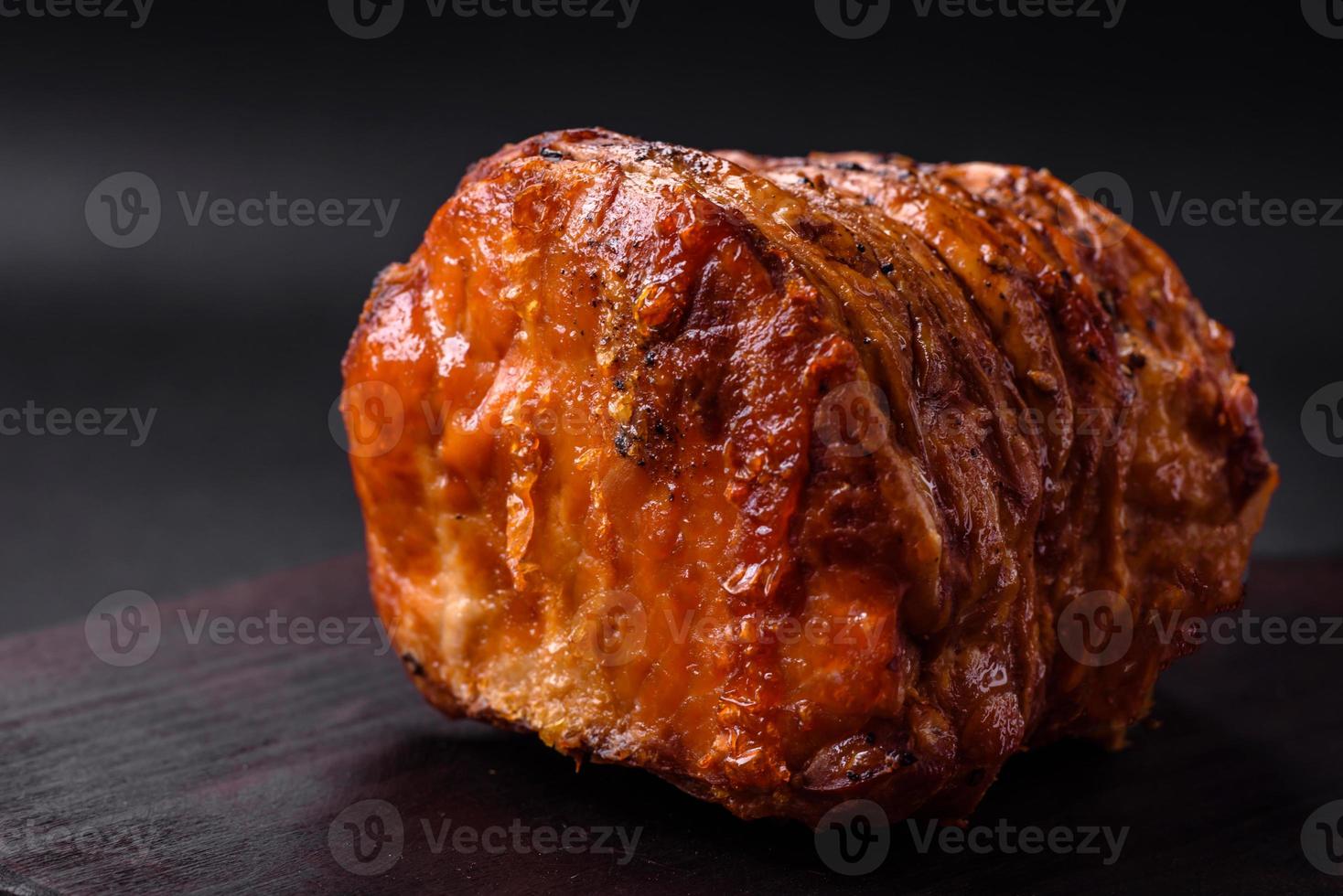 Delicious fresh smoked meat or ham with spices and herbs photo