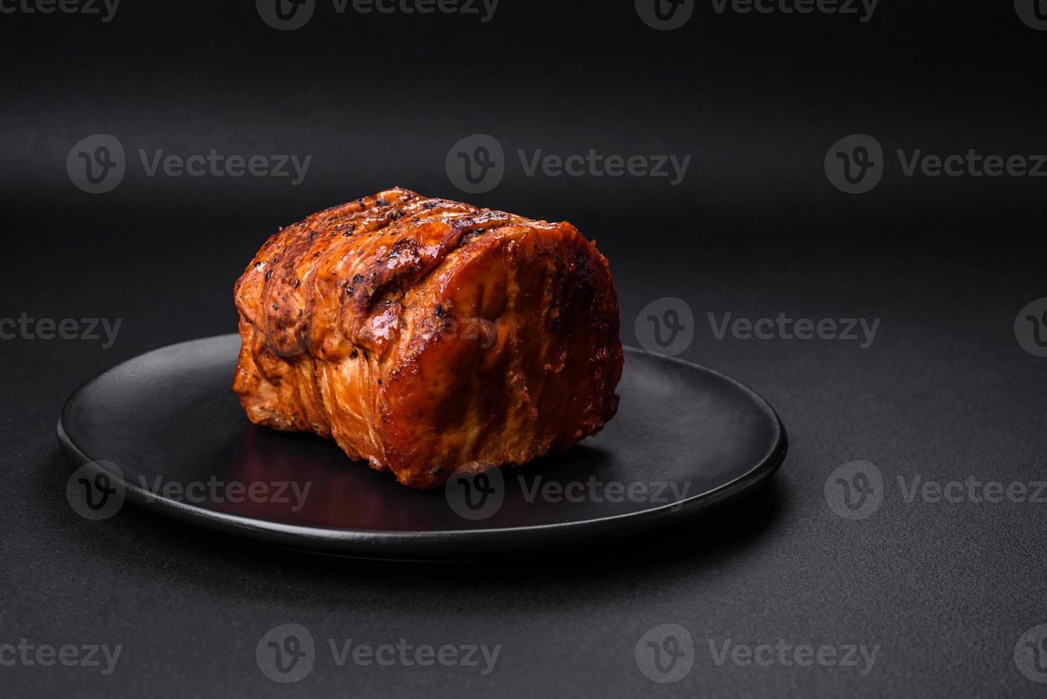 Delicious fresh smoked meat or ham with spices and herbs photo