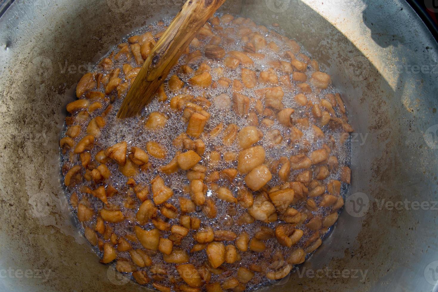 A deep fry fying pan close up very hot with chips photo