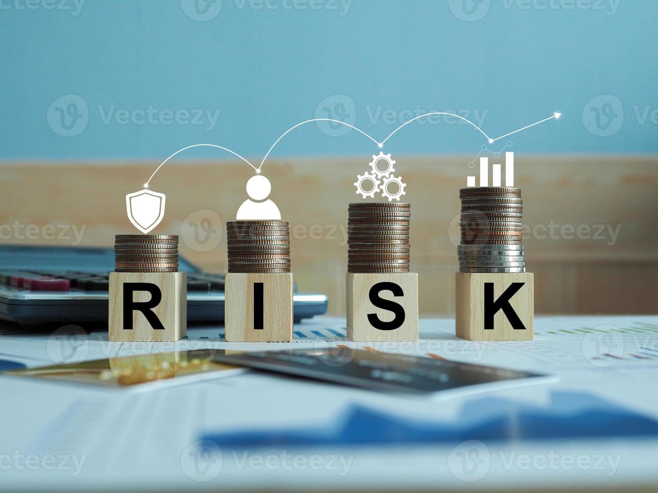 wooden blocks with risk words The concept of risk management, the work of an enterprise business that is on risk. photo