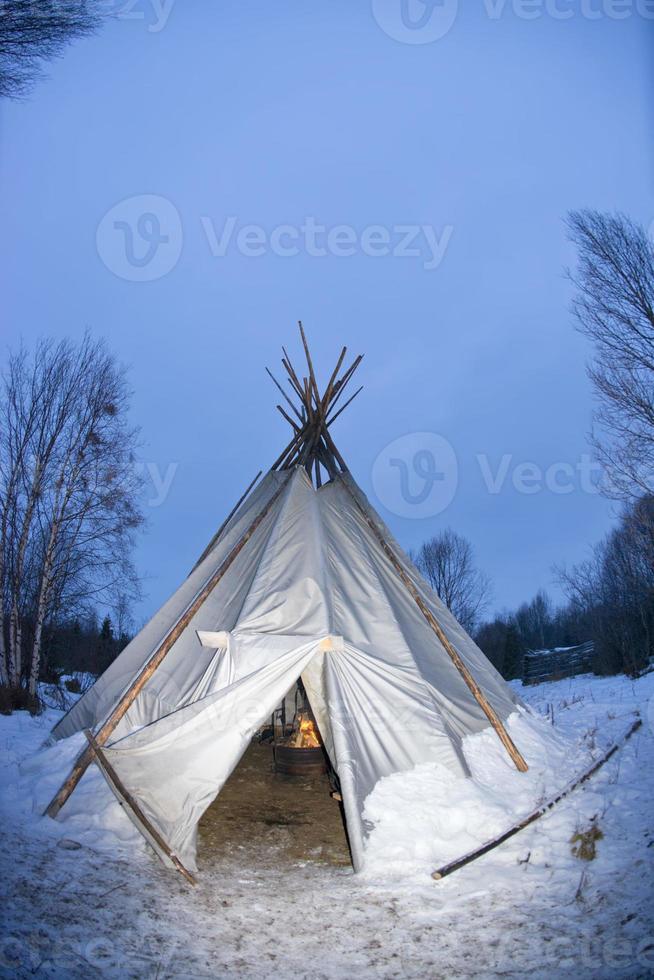 teepee in the snow background photo