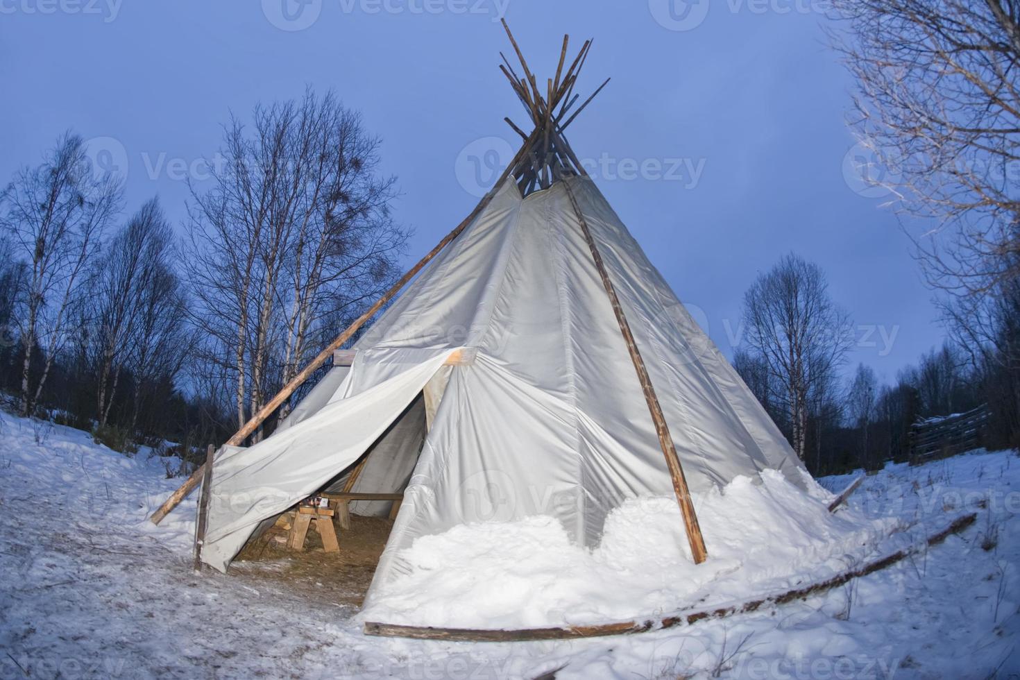 teepee in the snow background photo