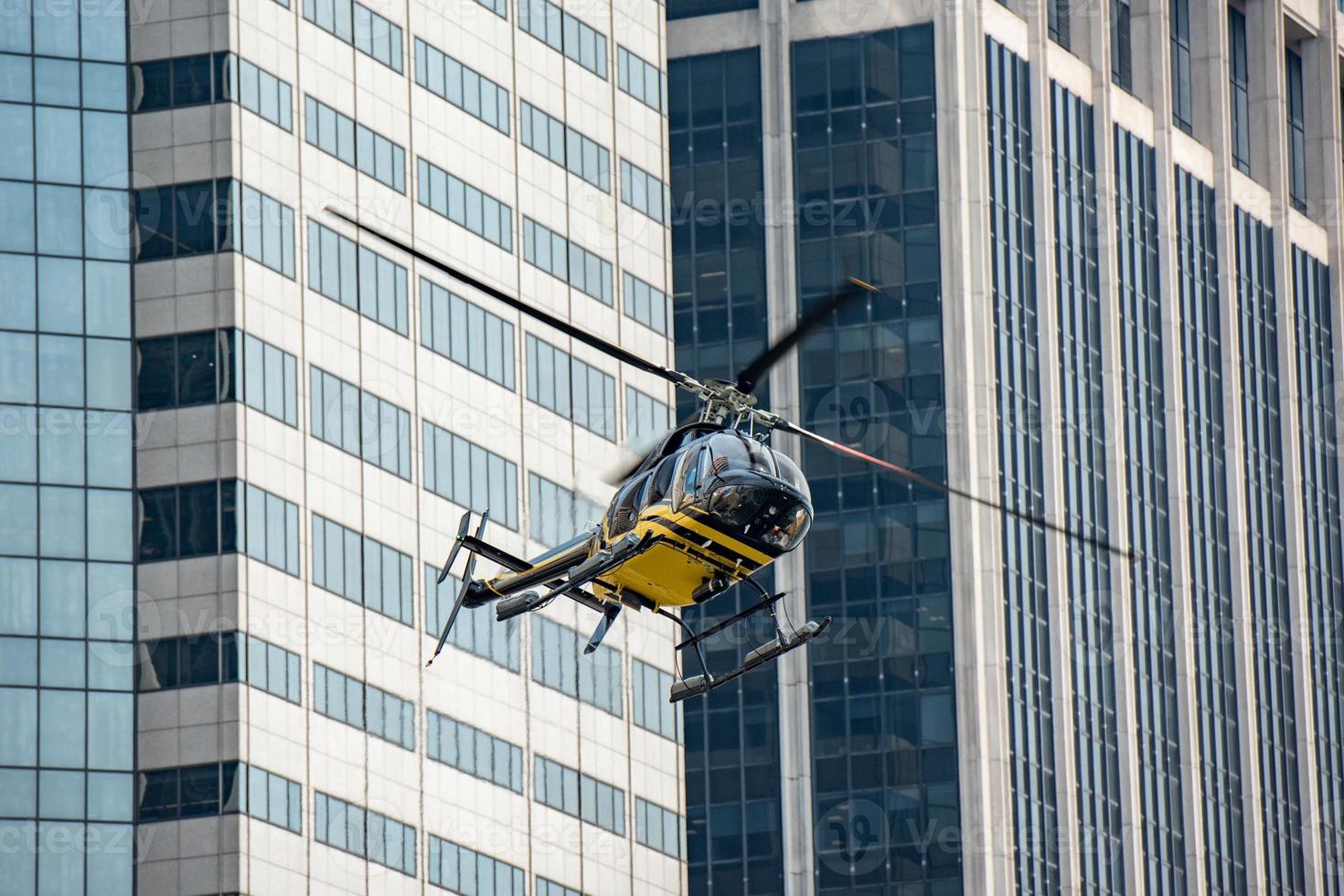 Helicopter on manhattan building background photo