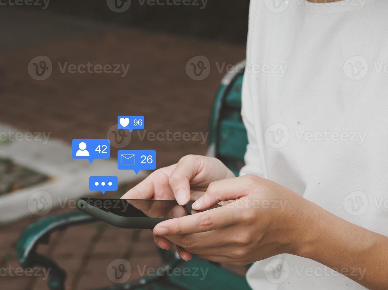 mobile social media marketing ideas social media Connecting to a large user database with notification icons such as messages, comments and hearts photo