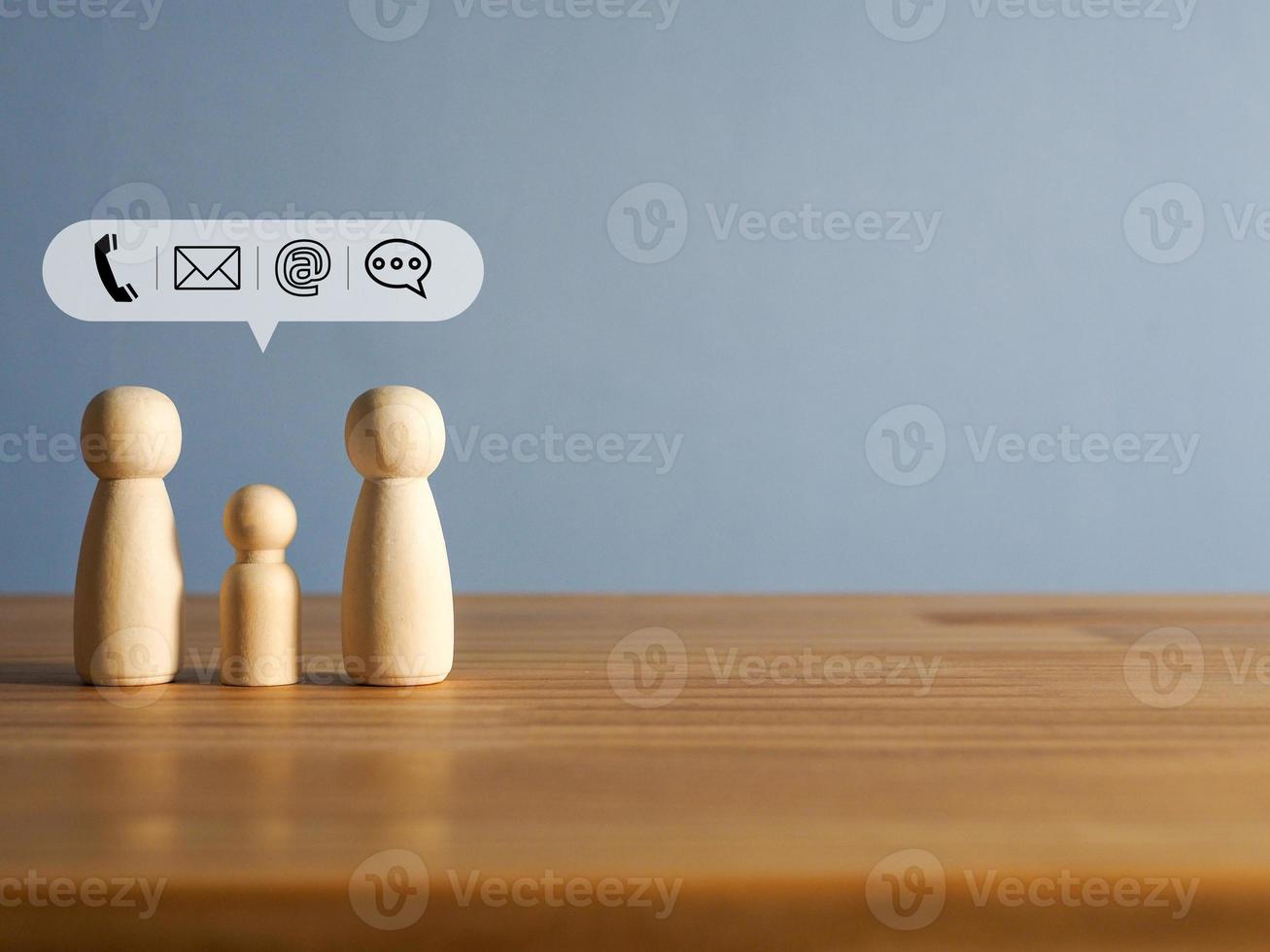 Family wooden man with icons phone, email, address, chat photo