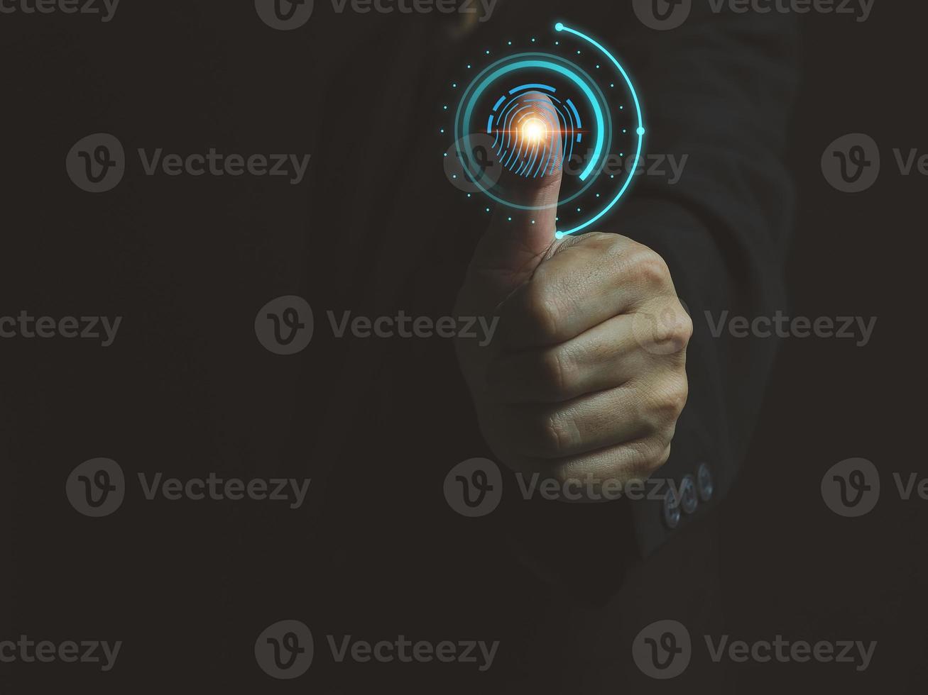Businessman's hand scanning fingerprint Authenticate access to business information photo