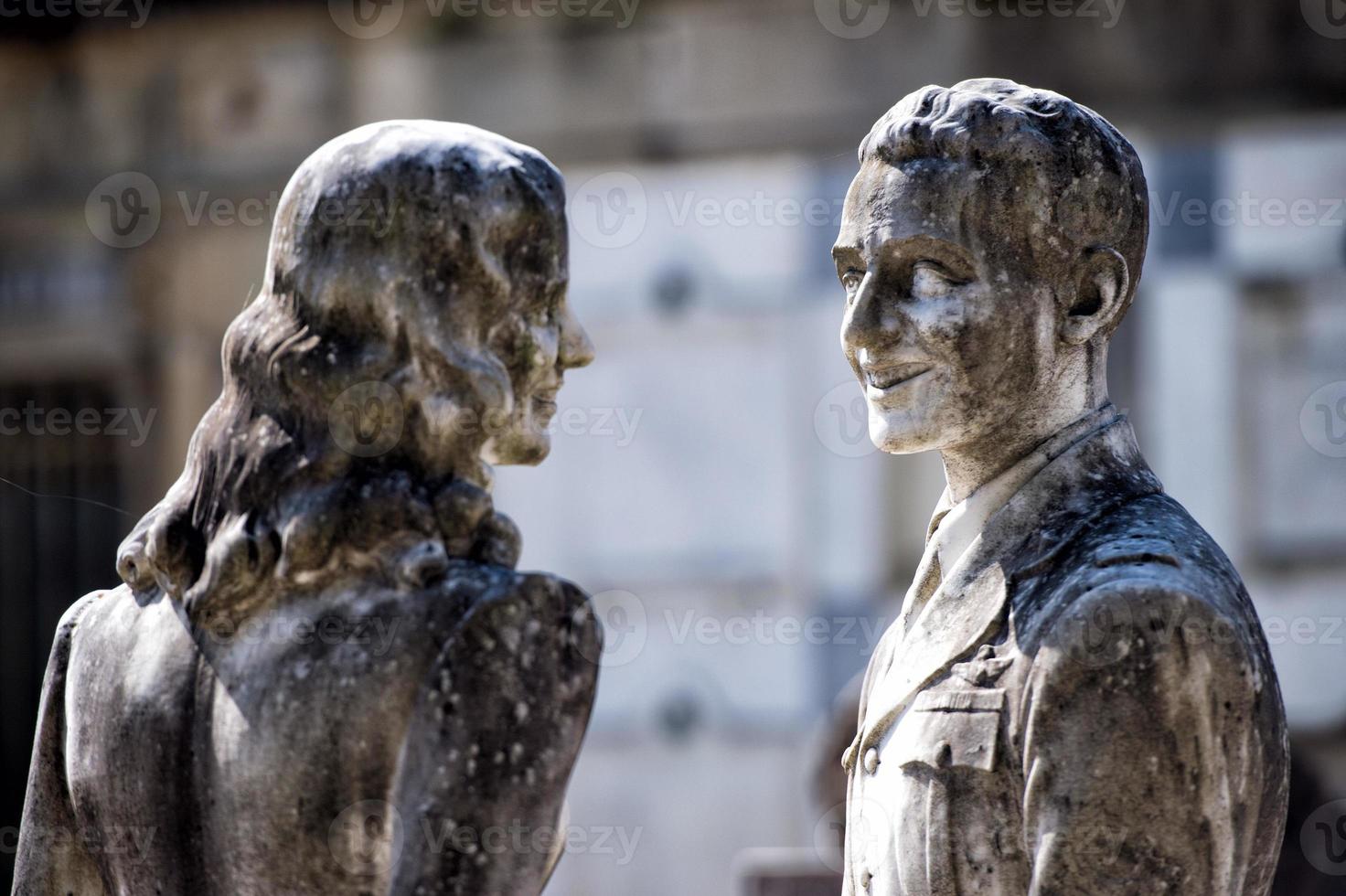 young lovers while smiling marble statue photo