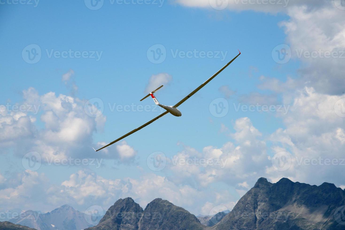 glider over swiss alps glacier view in Engadina photo
