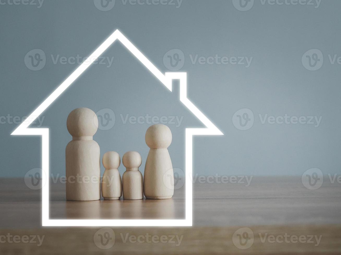 The house icon protects the wooden family model. Life and health insurance. Home insurance for grandchildren photo