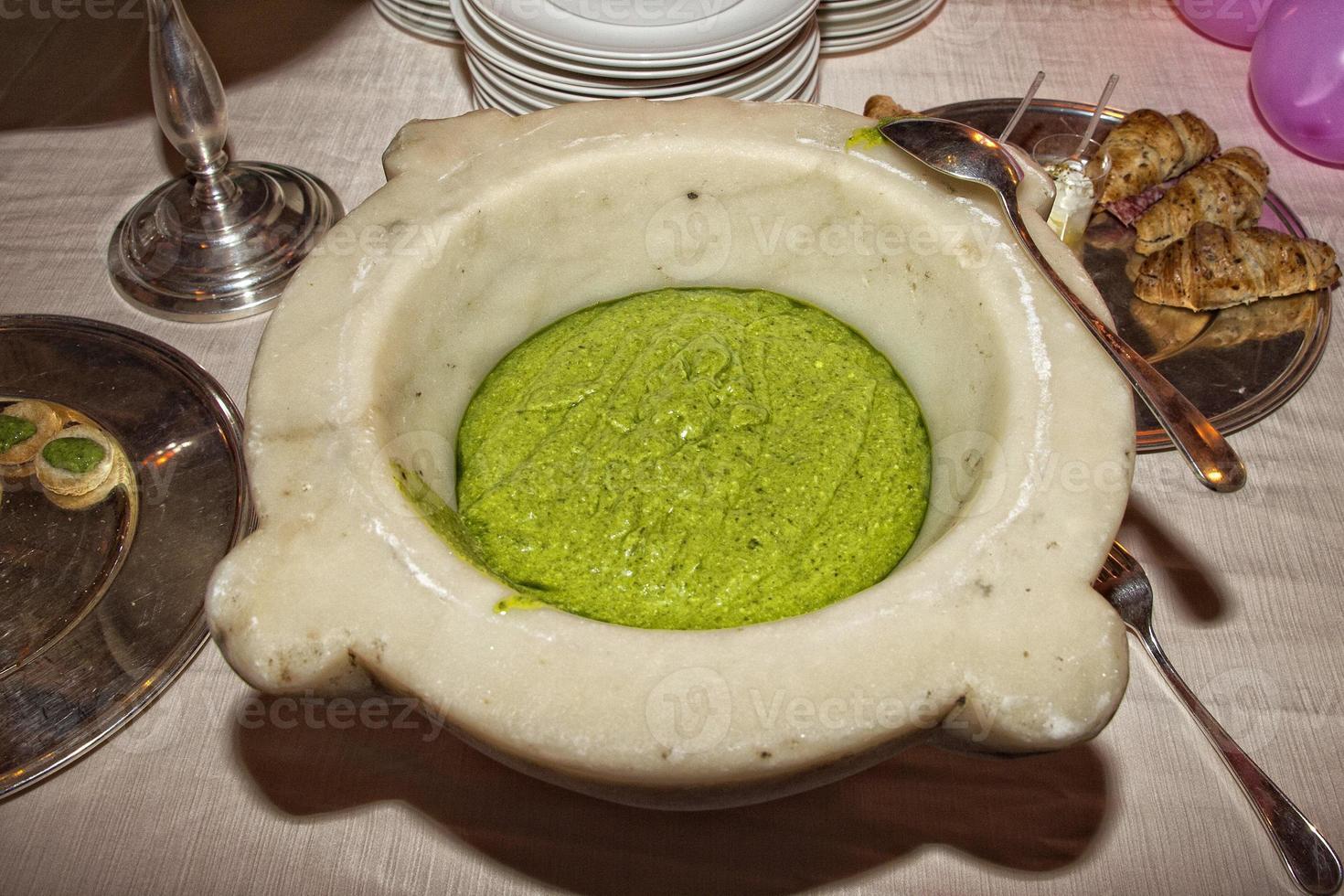 pesto sauce in marble mortar photo