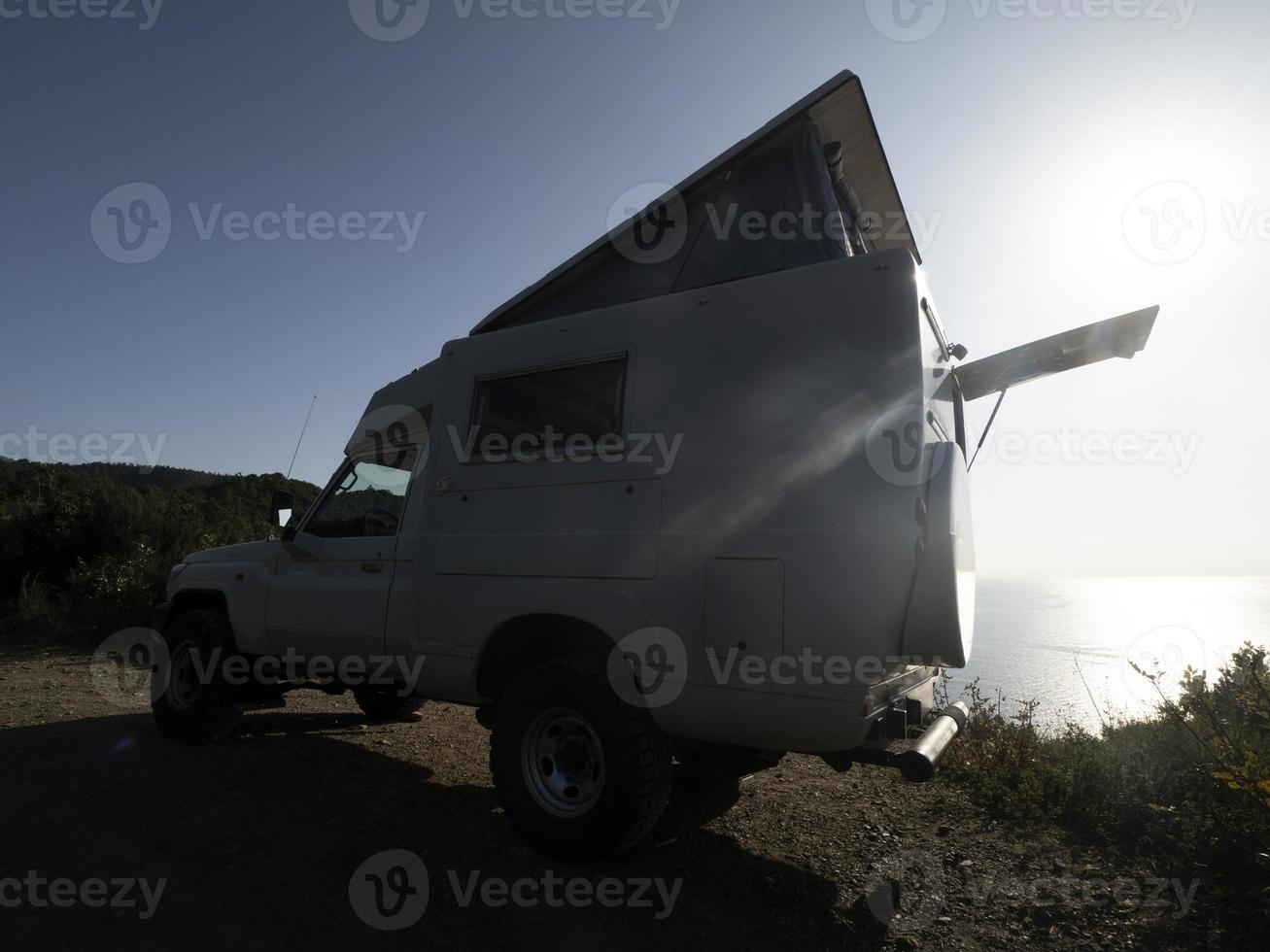 rv by the sea on backlight photo