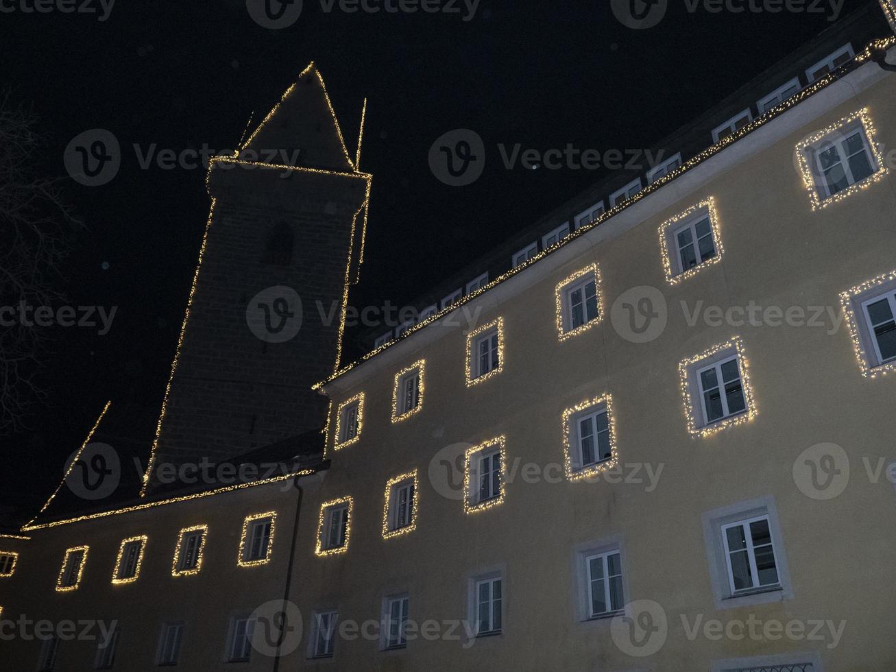 brunico village at night in december xmas lights photo