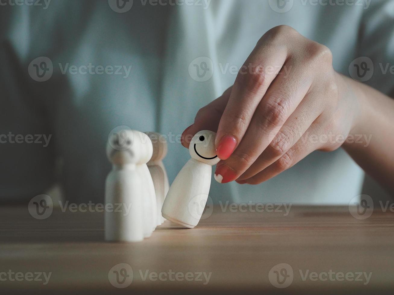 The wooden puppet with a smiling face left the crowd with a grimace. self development out of line photo