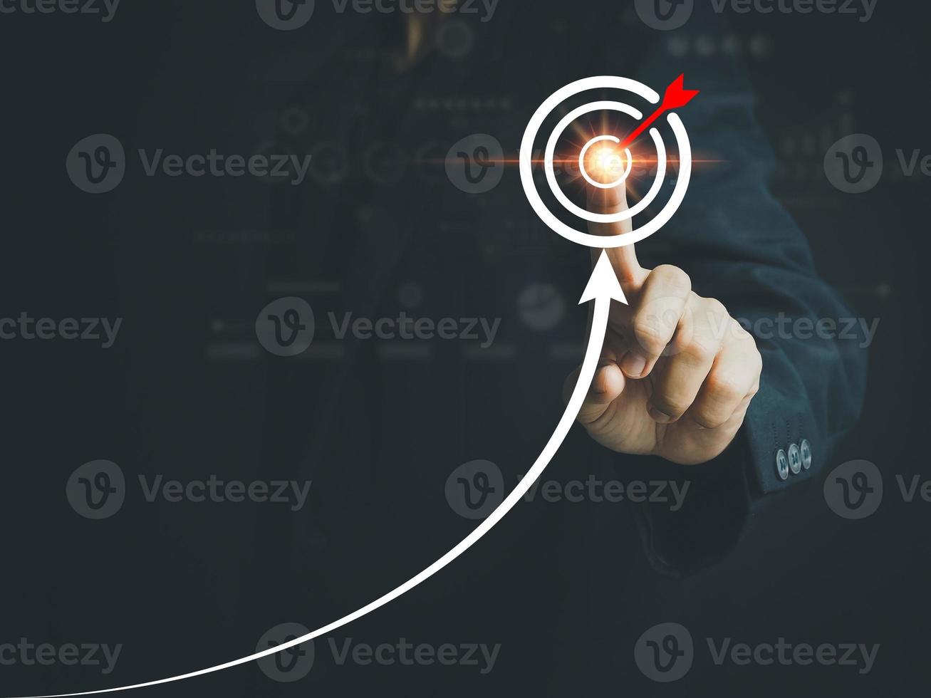 Businessman pointing to business success strategies on goals business growth achieving the goals that have been set Leading the organization to grow by leaps and bounds photo