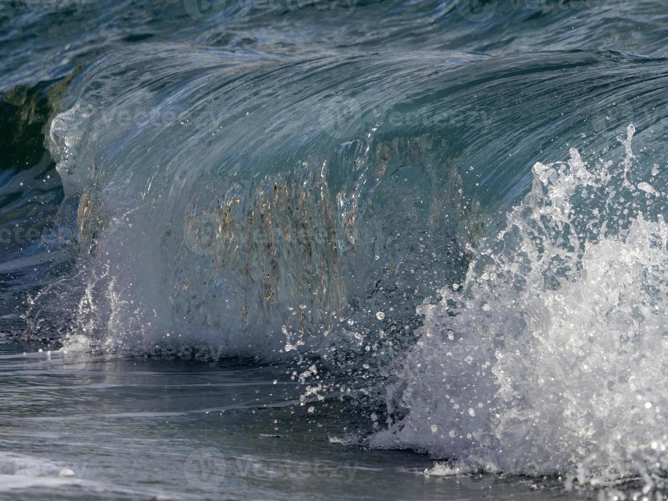 Sea wave on the shore photo