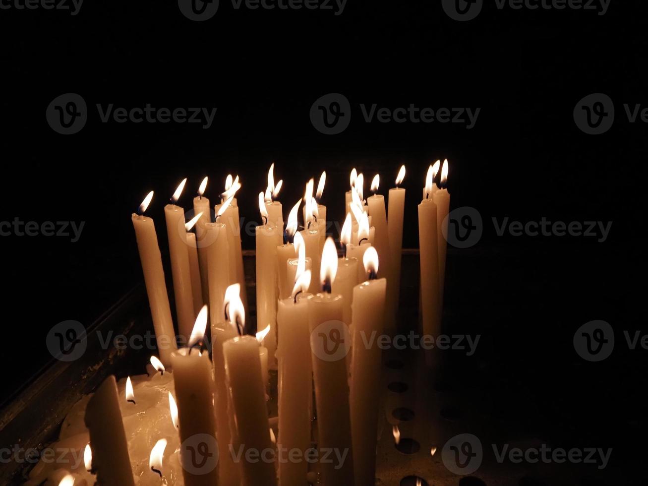 church votive candles white flames photo