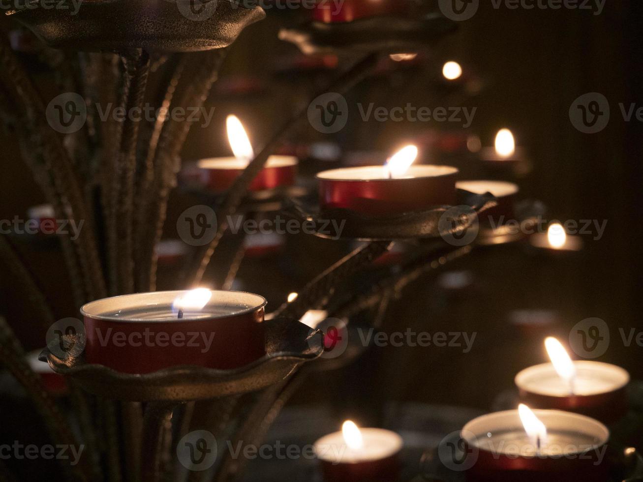votive candles inside church of riomaggiore cinque terre pictoresque village photo