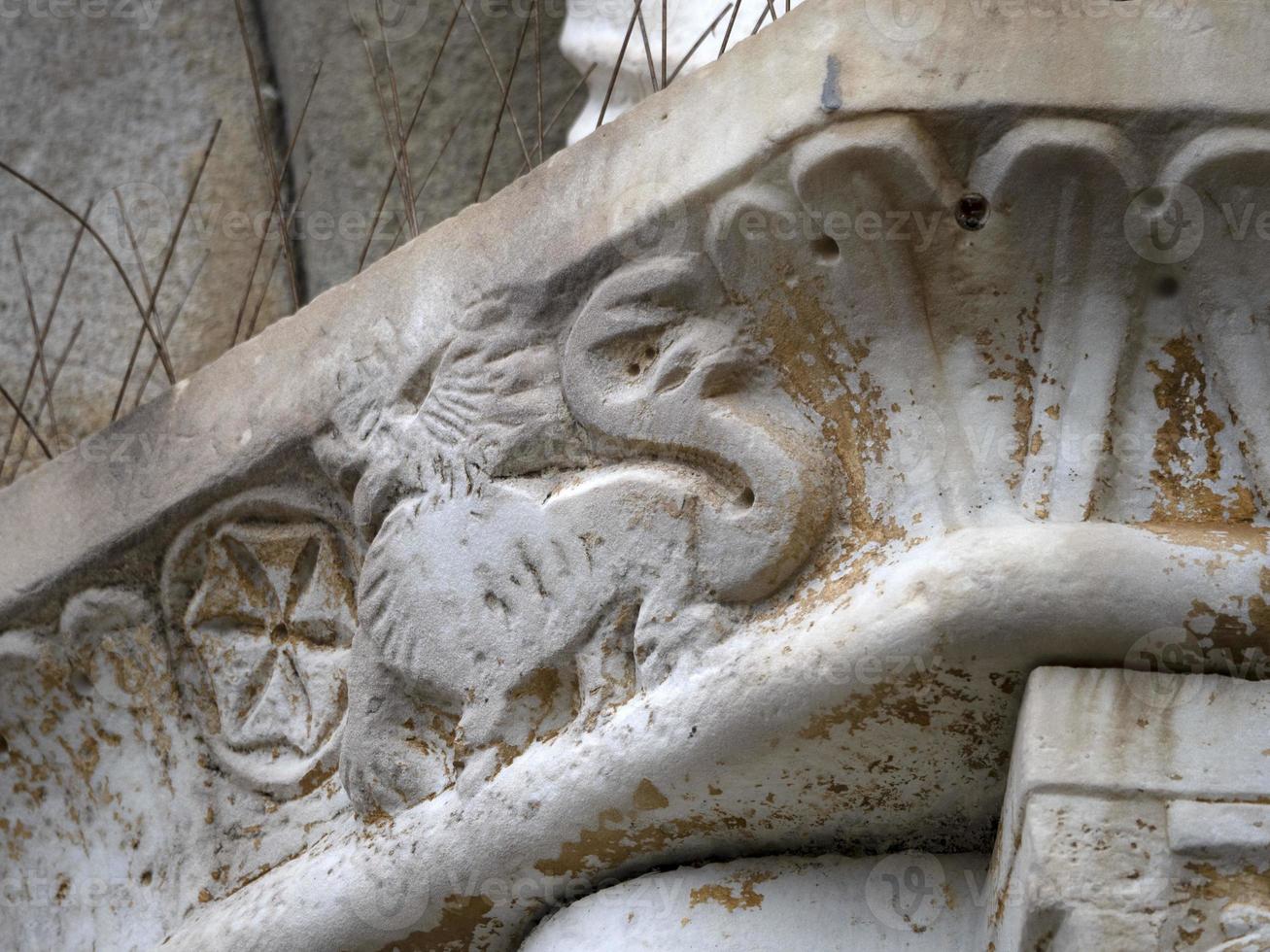 bas relief statue sculpture of church of riomaggiore cinque terre pictoresque village photo