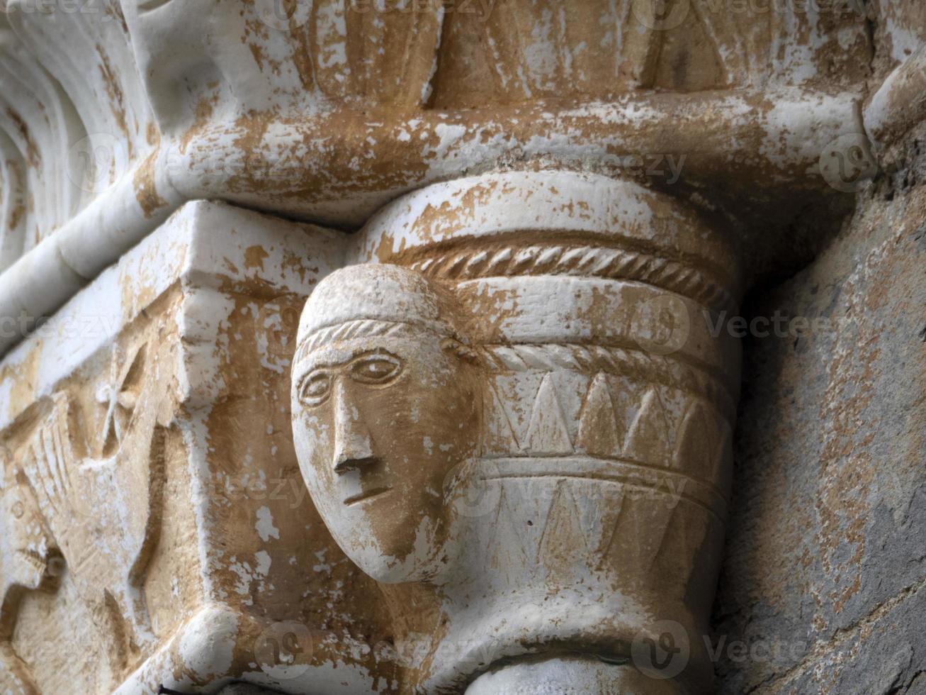 bas relief statue sculpture of church of riomaggiore cinque terre pictoresque village photo