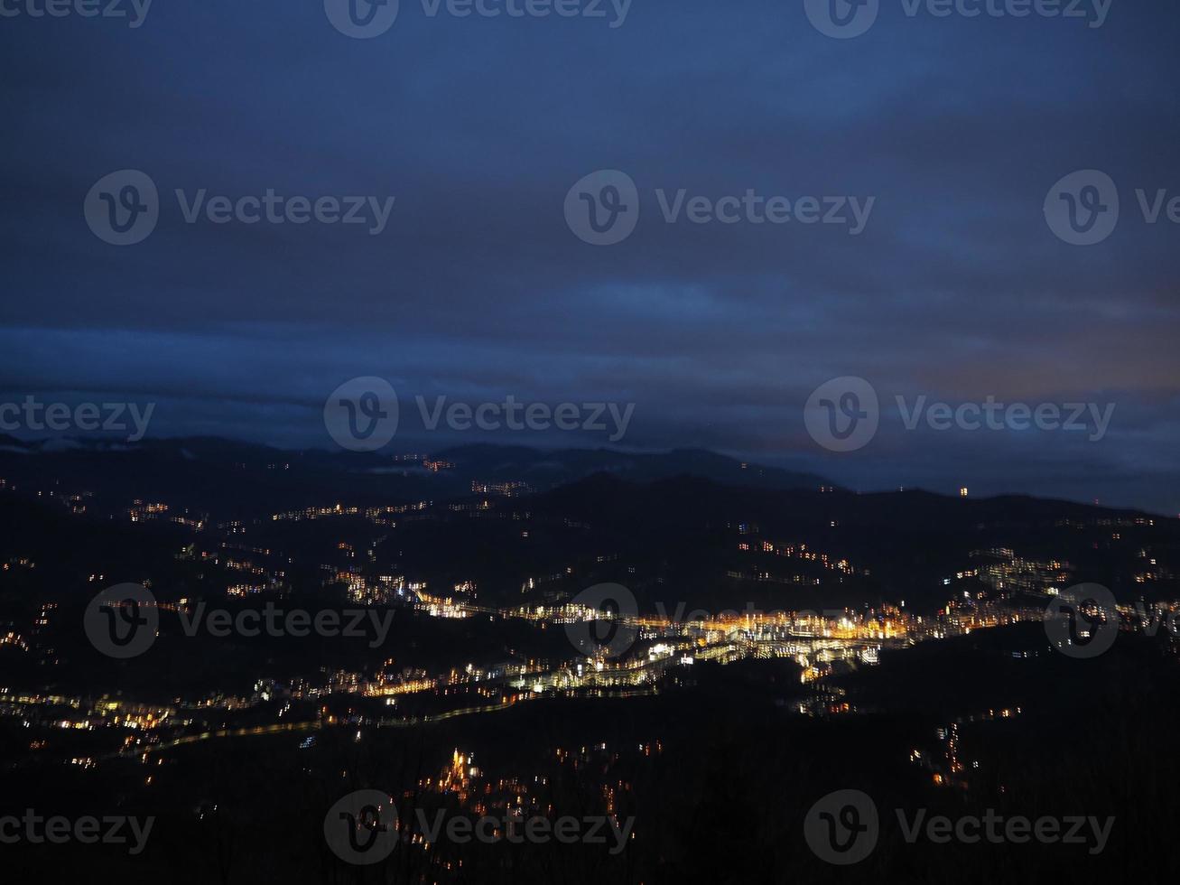 Night panorama from Madonna della Guardia votive offering sanctuary on Genoa mountain hill photo
