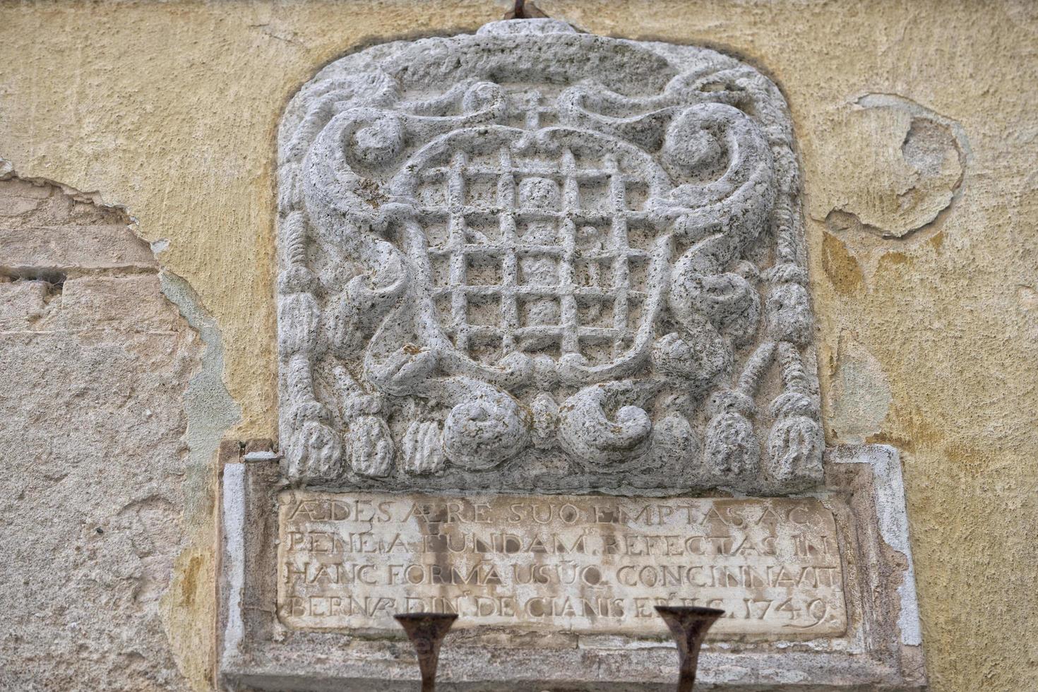 san quirico medieval houses stone wall vatican bas relief photo