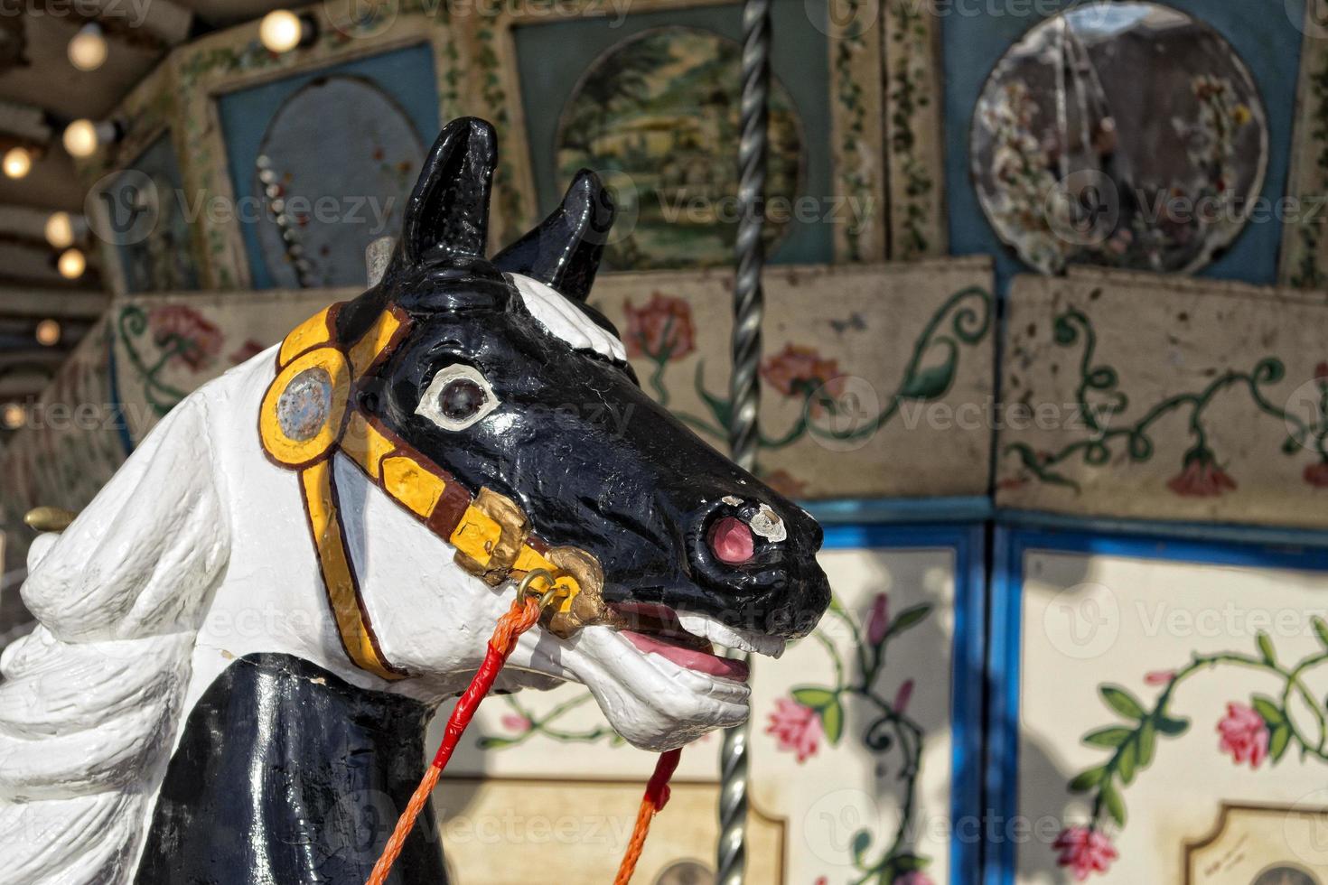 old vintage carousel wooden horse detail photo