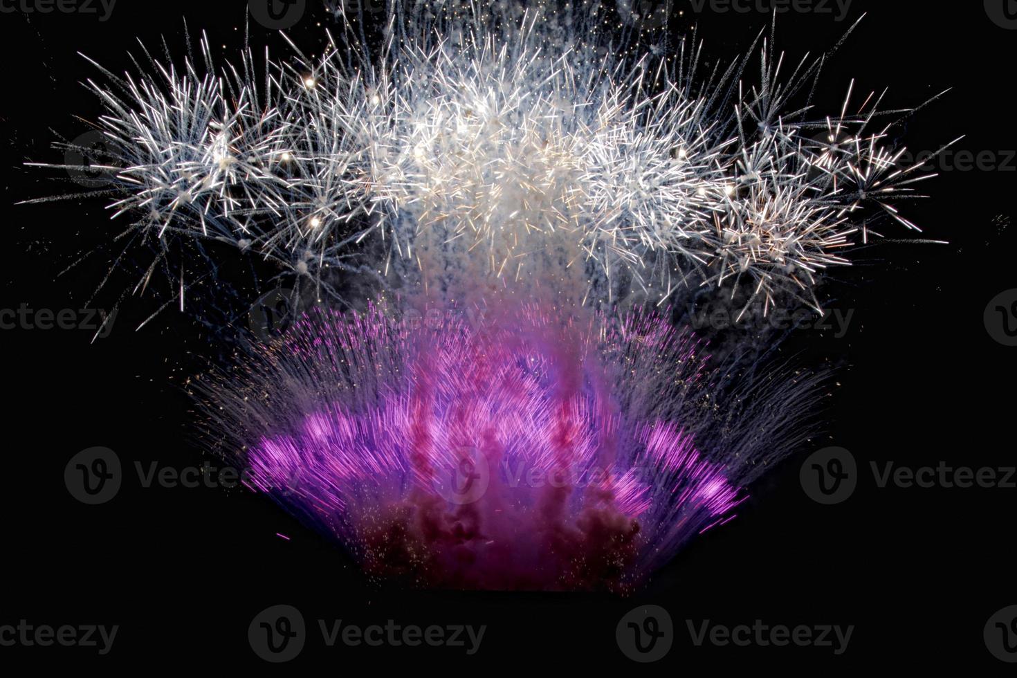 Happy new year and merry xmas fireworks on black background photo