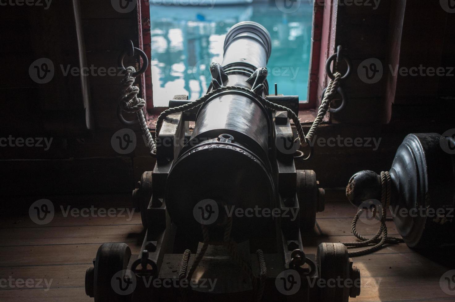 iron cannon on sail ship photo