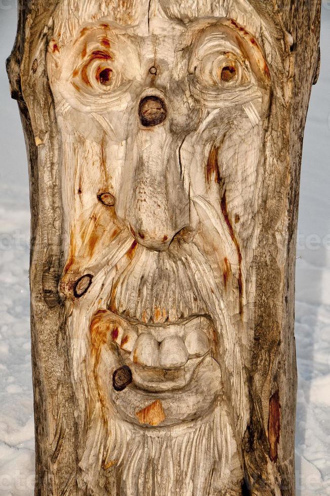 wood carved troll face photo