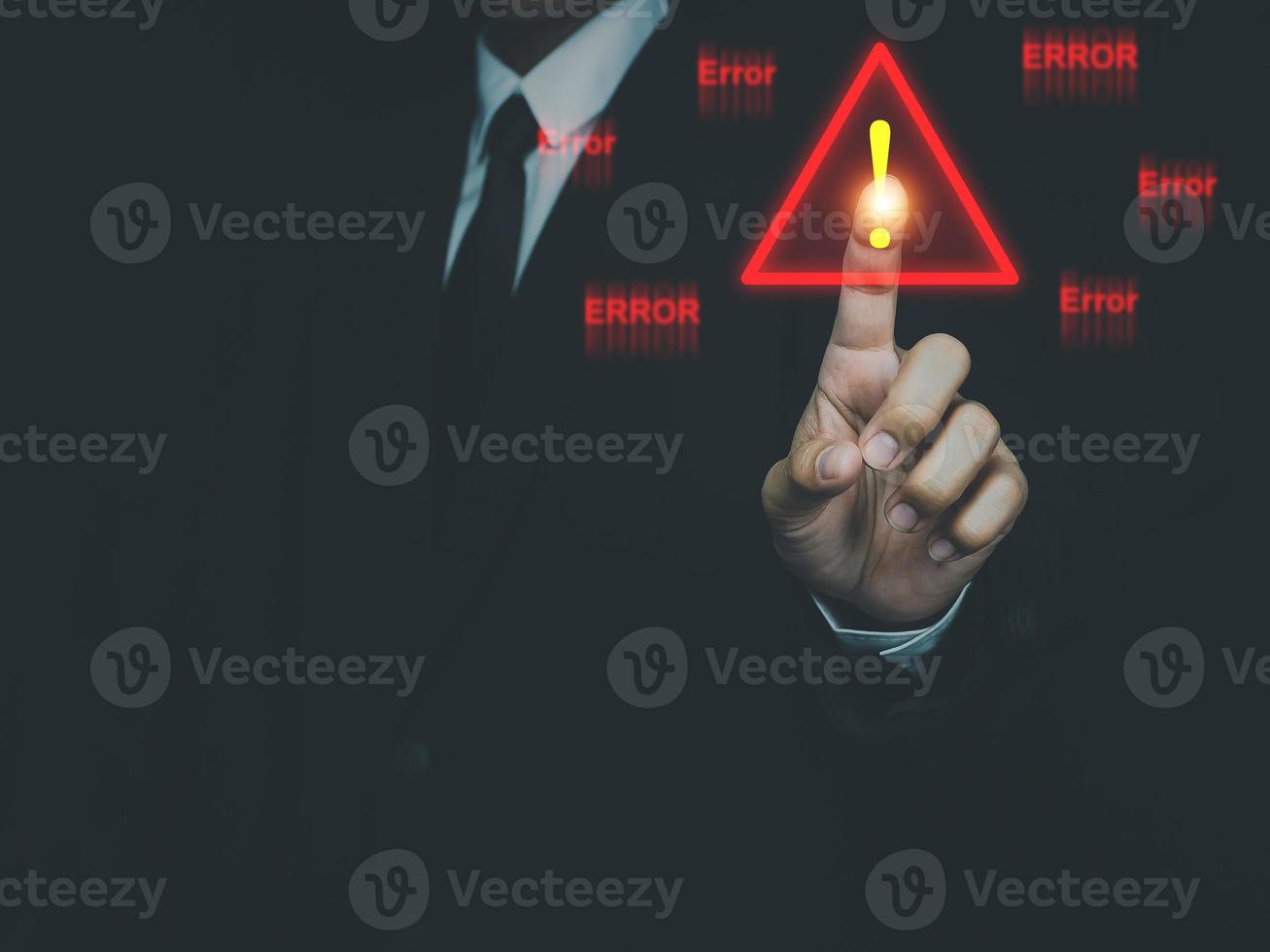 Businessman pressing or choosing Triangle warning sign for system error notification. Error notification abnormal system operation photo