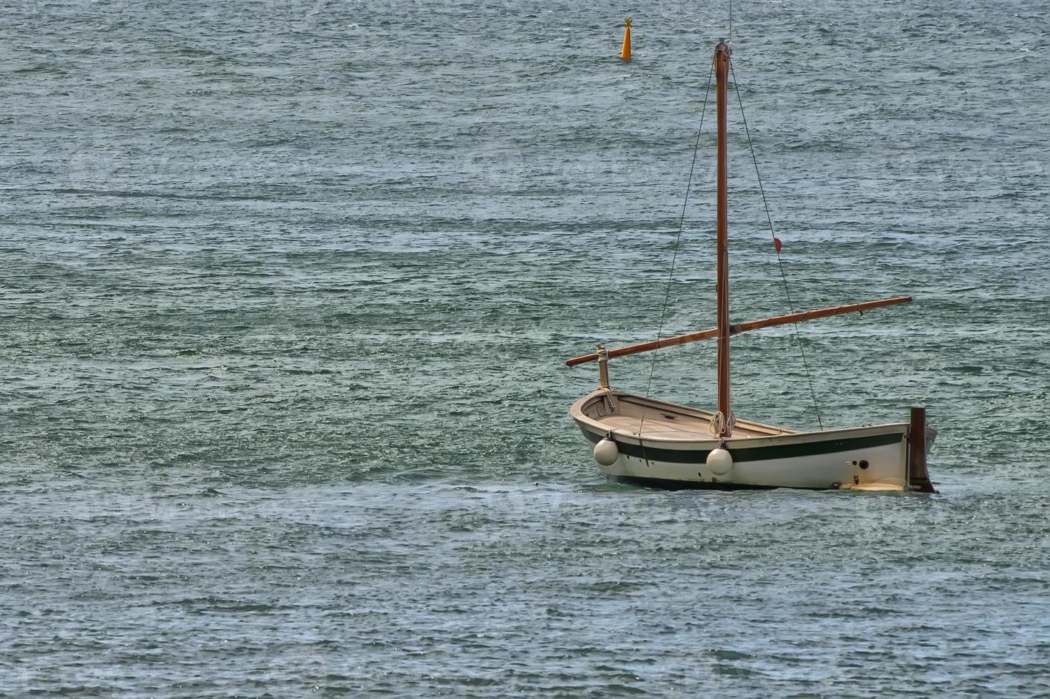 Fisherman wooden boat mooring at the harbor photo