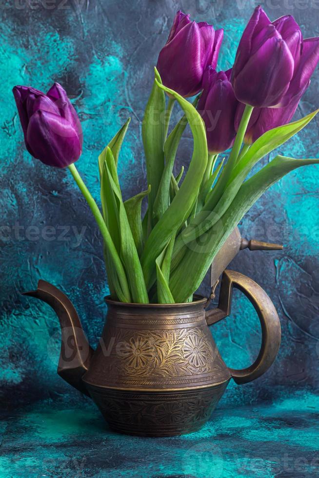 Bouquet of tulips for the holiday. Women's day, Valentine's day, name day. On a dark background with reflection. photo