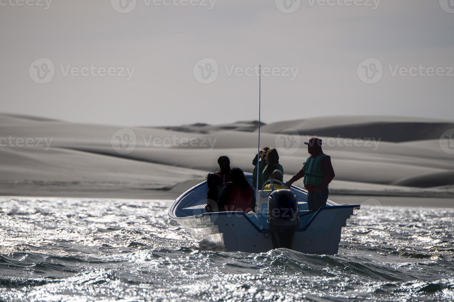 fisherman boat Magdalena Bay mexico near sand dunes photo