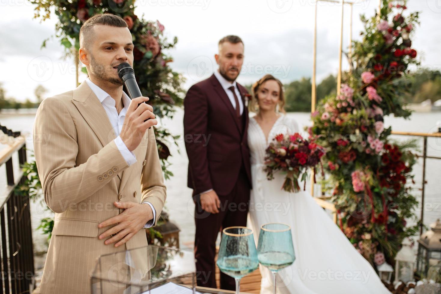 wedding ceremony of the newlyweds on the pier photo