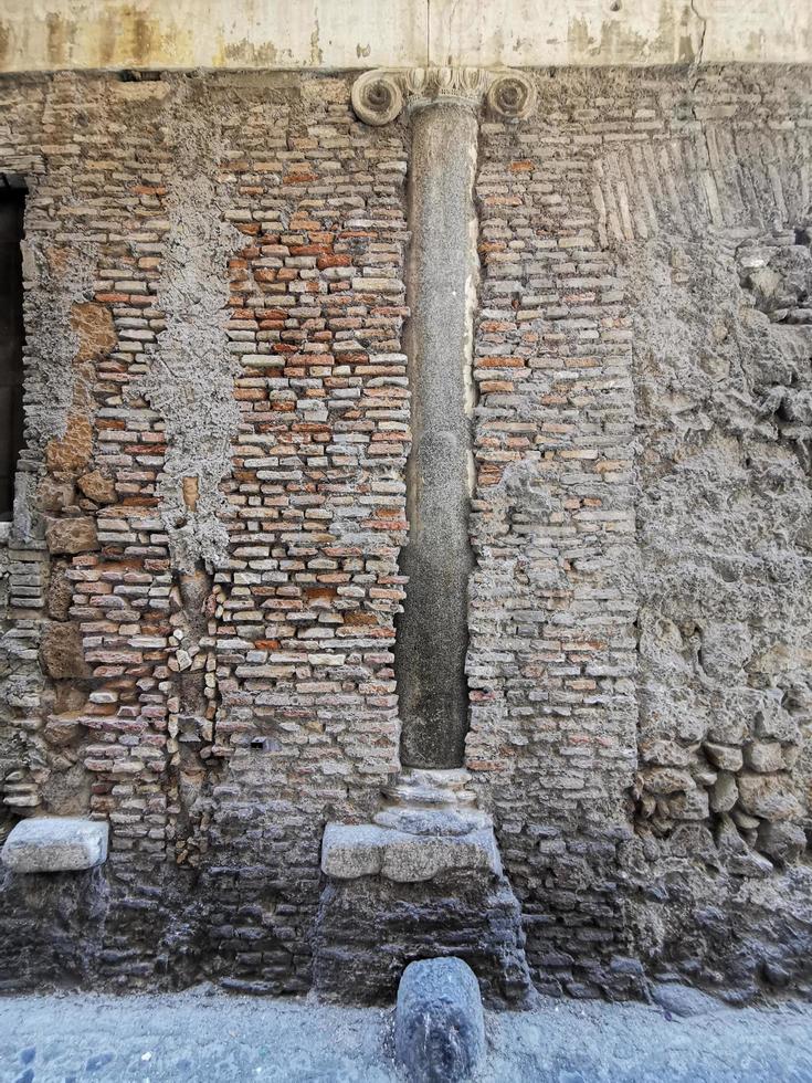 old roman columns inside medieval building in rome photo