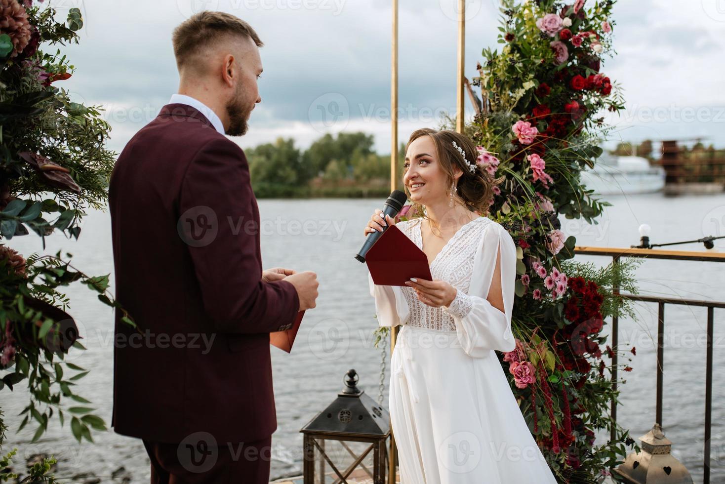 wedding ceremony of the newlyweds on the pier photo