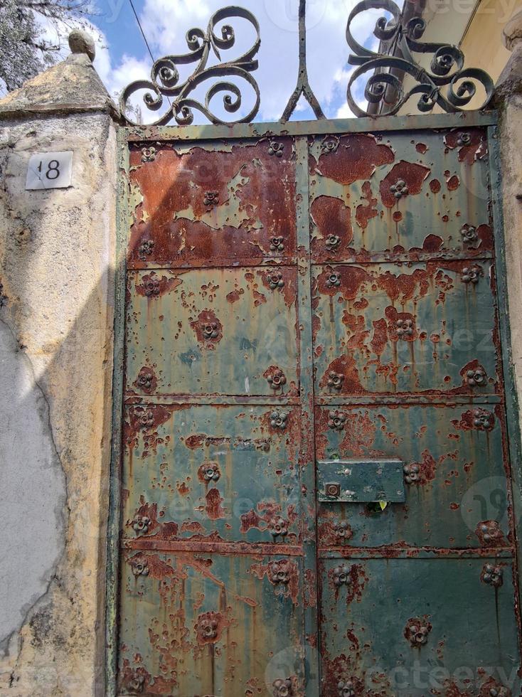 old rusted metal door fence photo