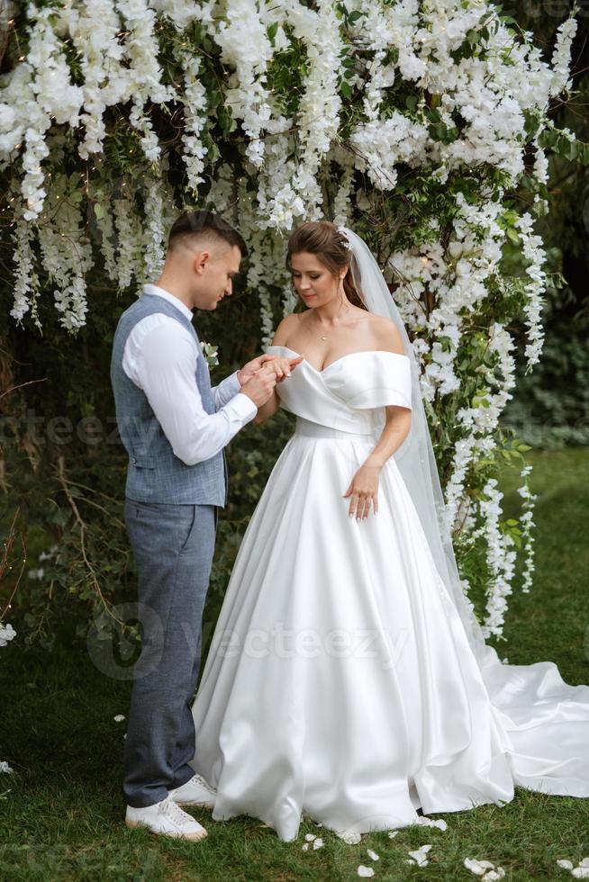 wedding ceremony of the newlyweds on the glade photo