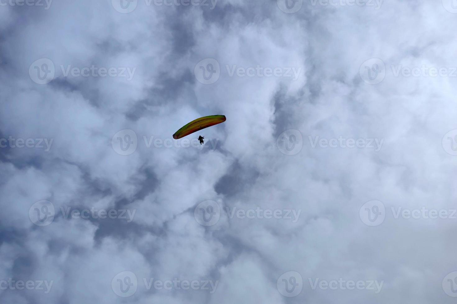 paraglider on cloudy sky photo