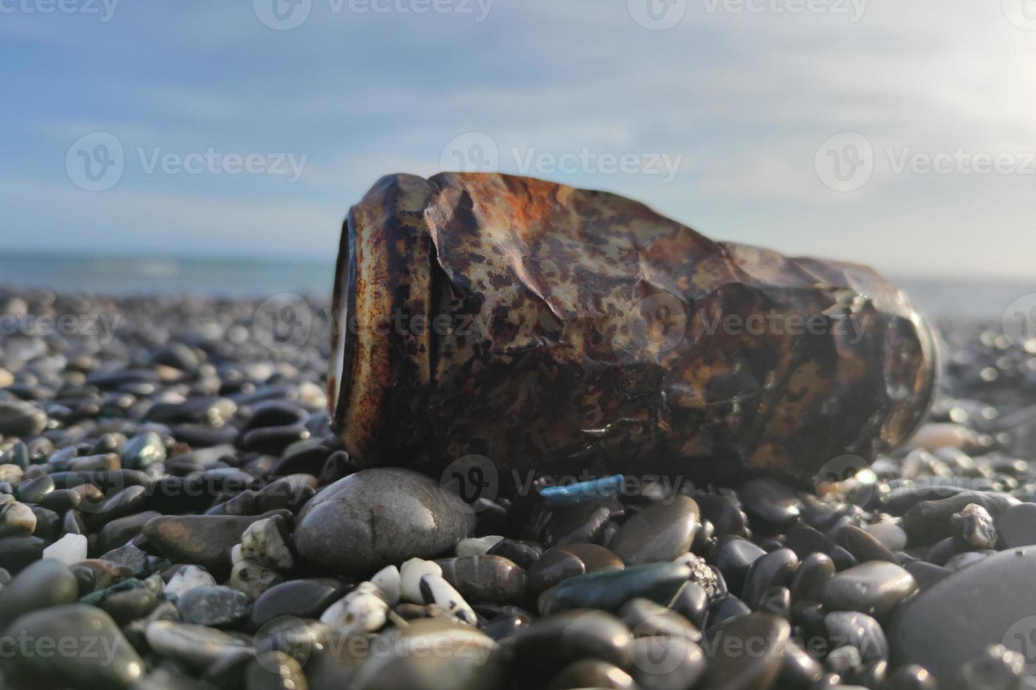 rusted can on the beach photo