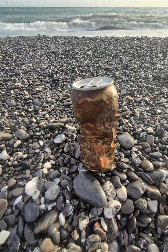 rusted can on the beach photo